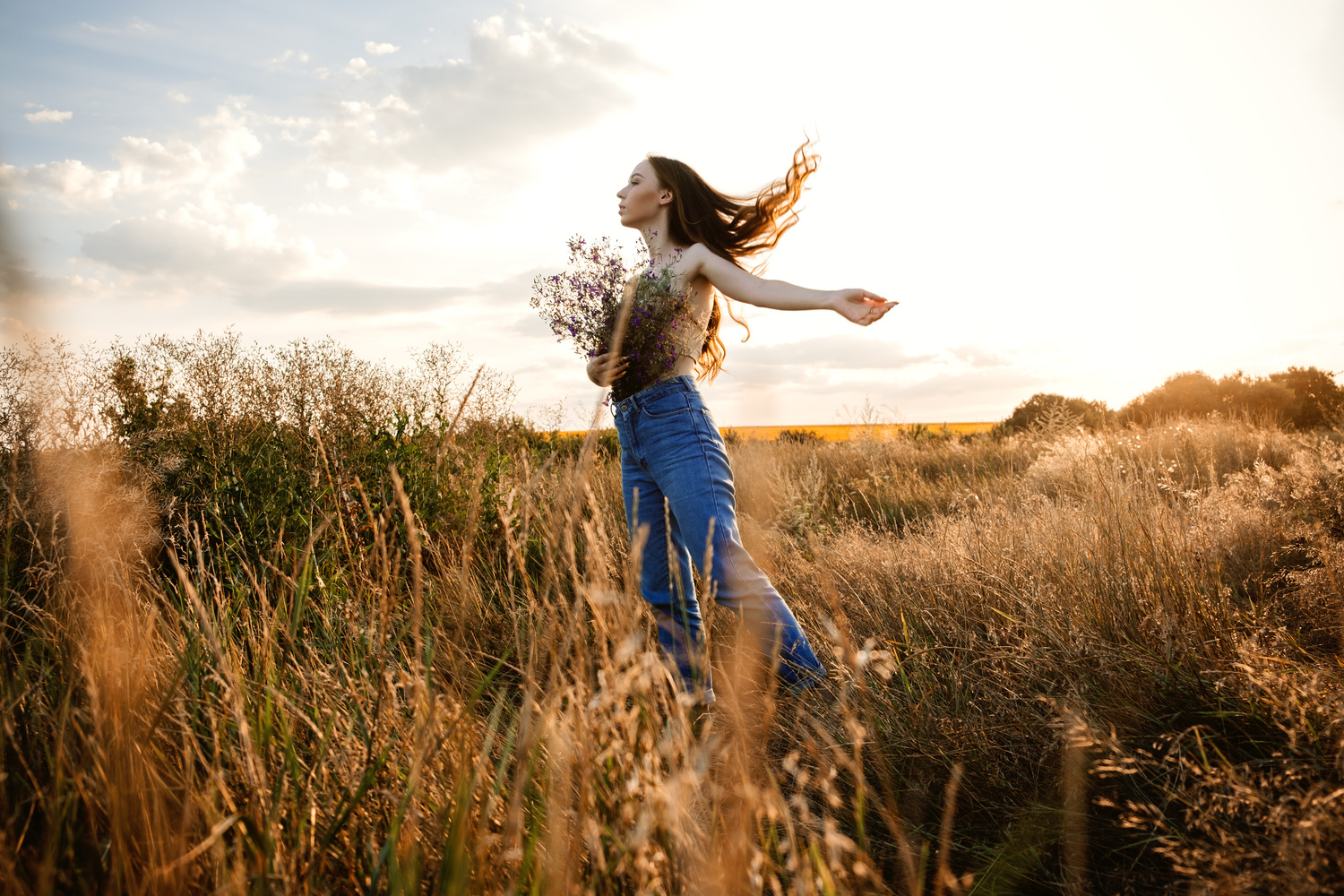 Woman in Field with Flowers